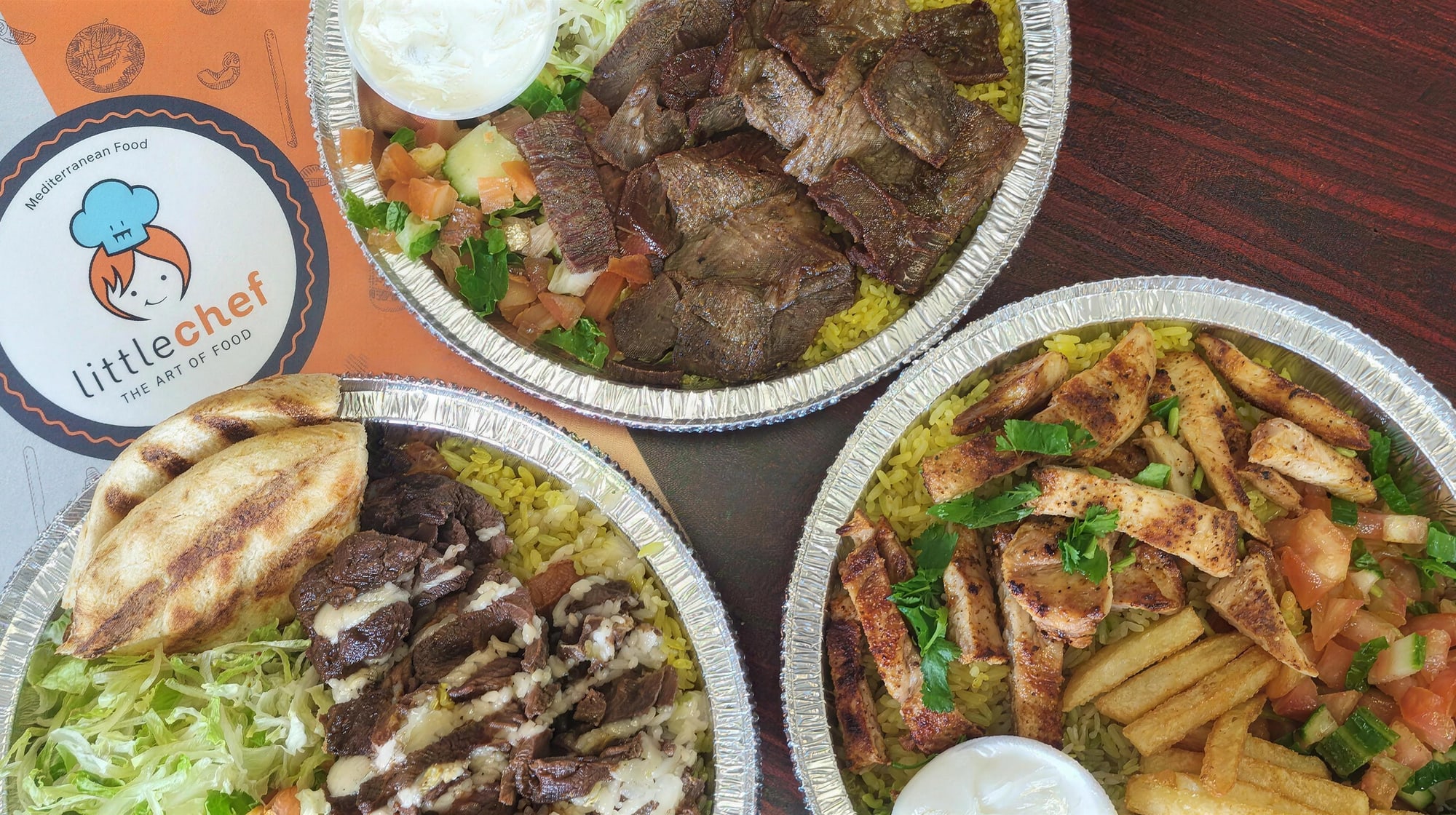 Little Chef Mediterranean catering spread — platters of beef shawarma, mixed grill, and chicken over rice